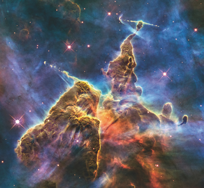 A 2010 NASA Hubble Space Telescope image of a turbulent cosmic pinnacle in the Carina Nebula, in the southern constellation Carina. The image celebrates the 20th anniversary of Hubble’s launch.